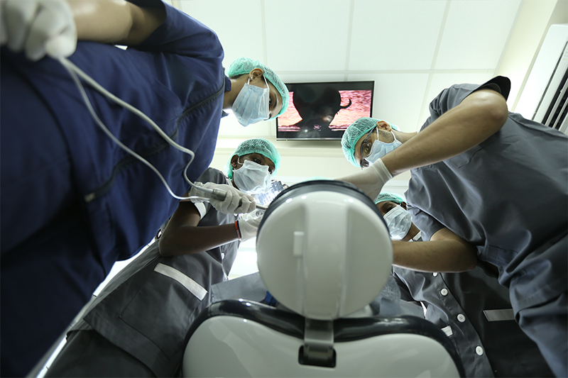 Dentist performing surgery