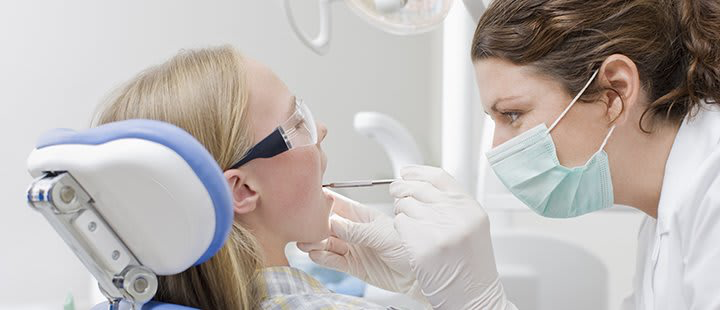 Dentist checking Patient