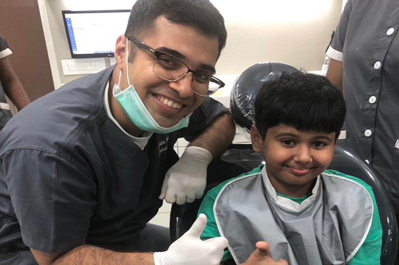 Dentist with kid