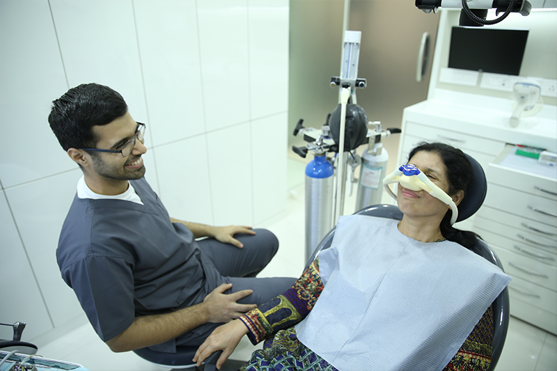 Dentist performing nitrous oxide sedation